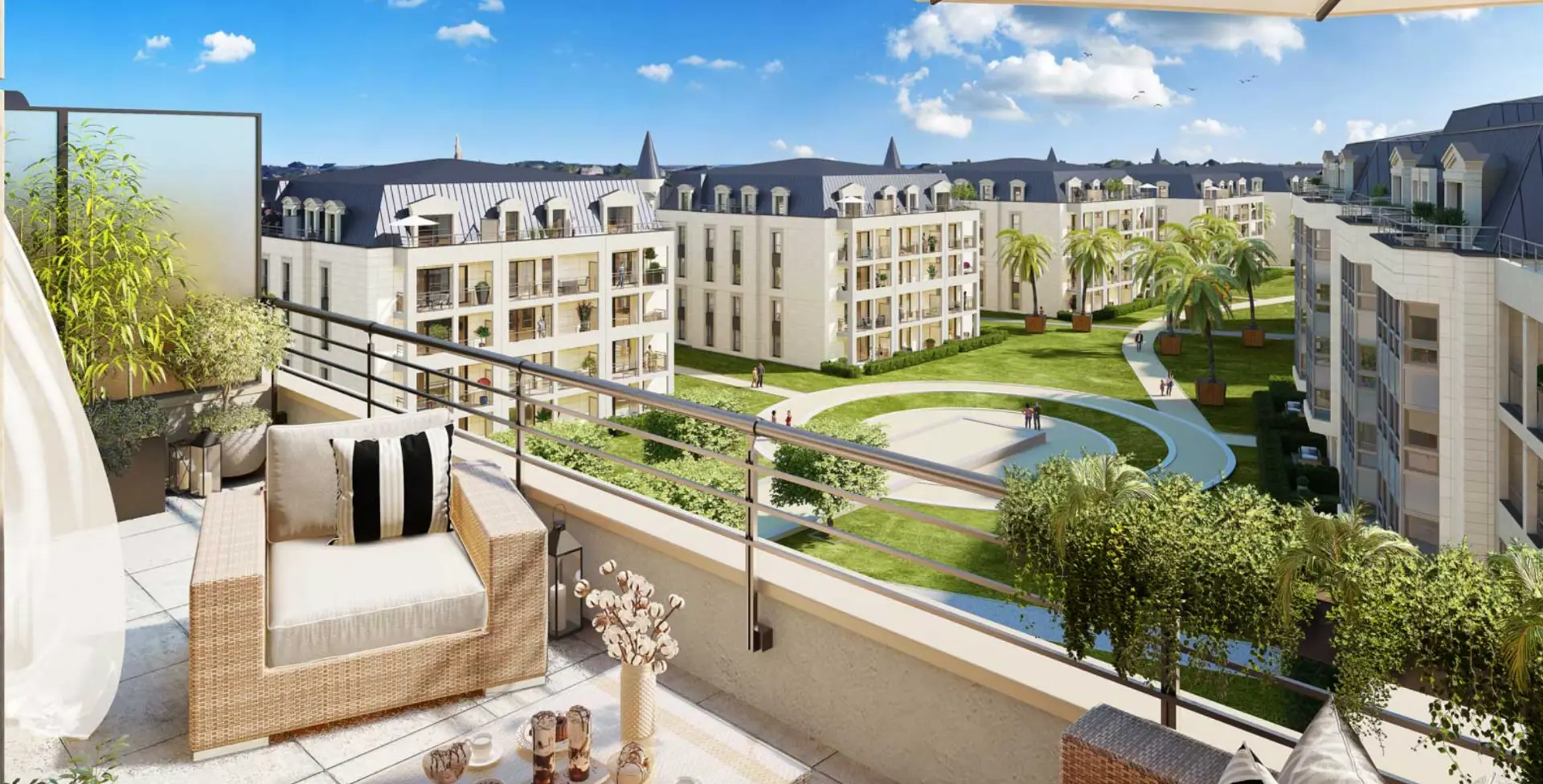 Vue du programme immobilier neuf Art Déco à Dinard depuis une terrasse : jardins paysagers et façades claires